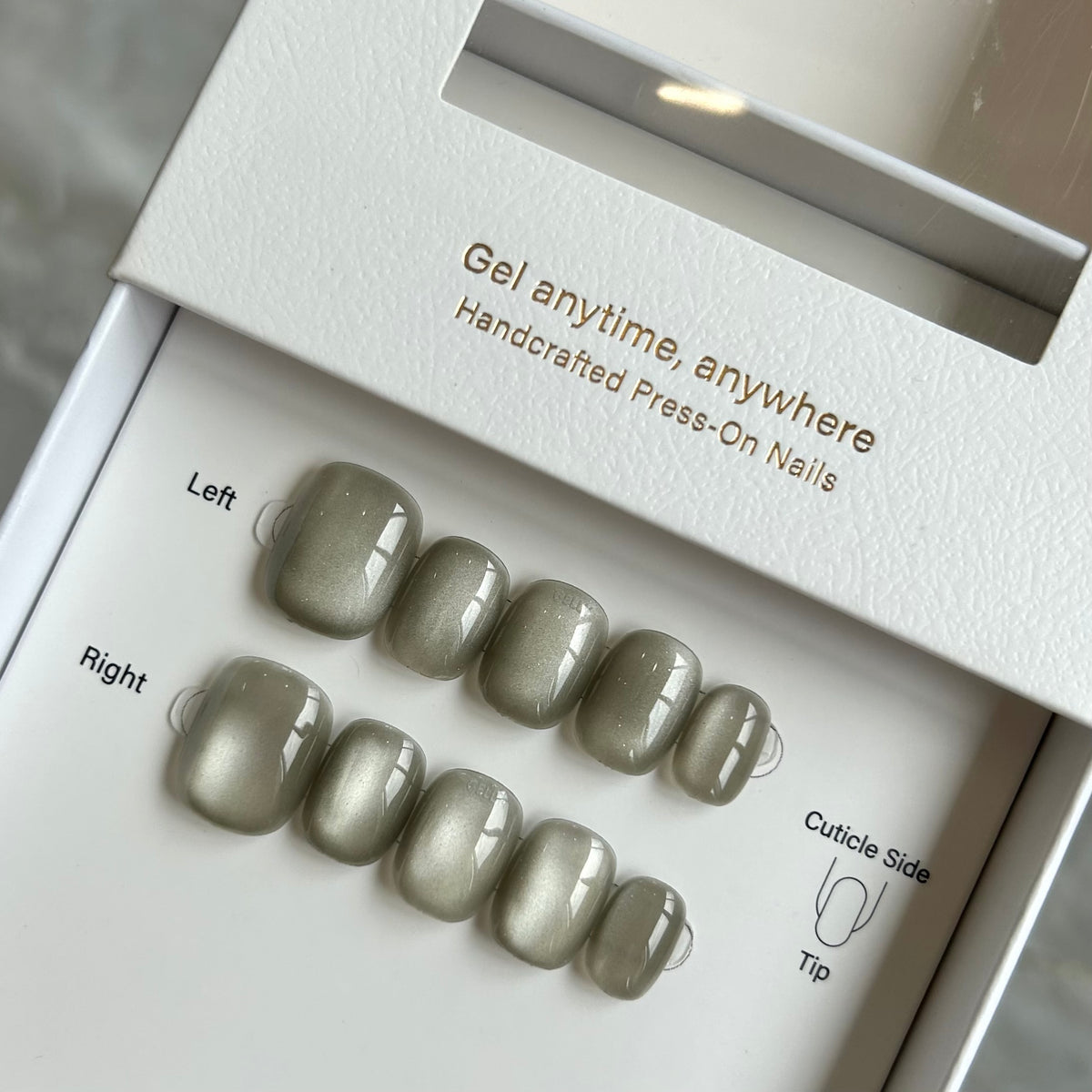 Close-up of hands with metallic GELLY press on nail, GELLY穿戴甲