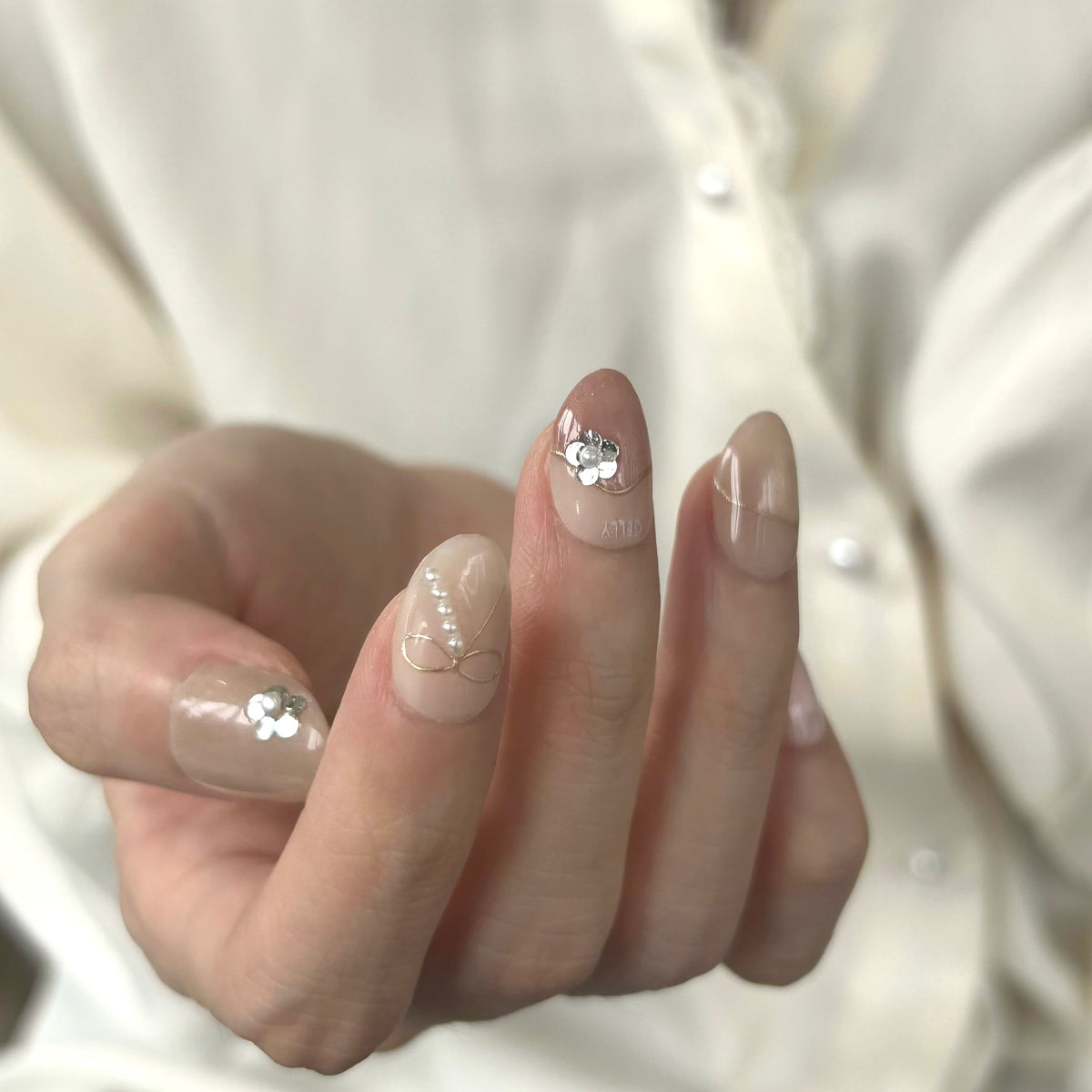 Close-up of a hand with GELLY press on nails