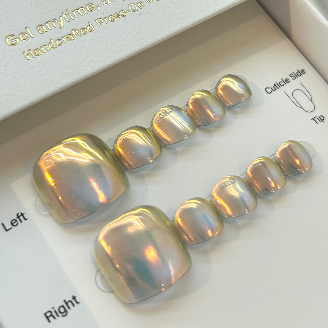 Set of press-on nails with a metallic finish on a white background