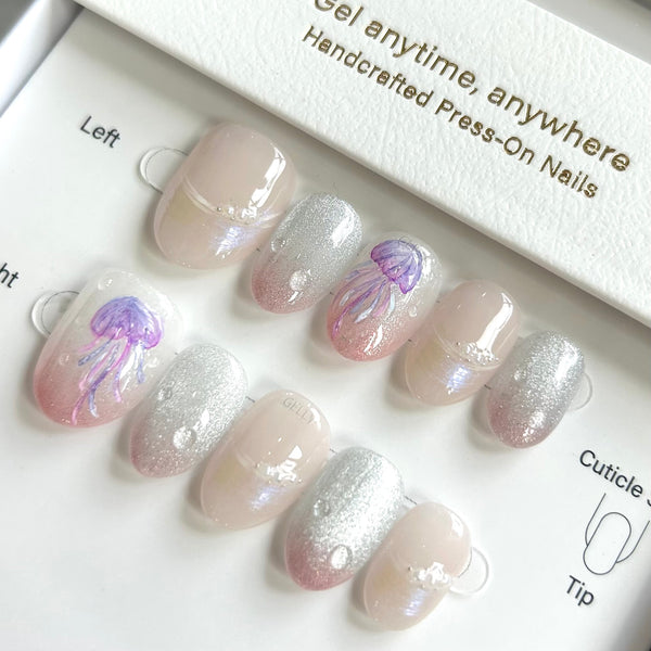 Set of press-on nails with glittery design in a box labeled 'Gel anytime, anywhere'.