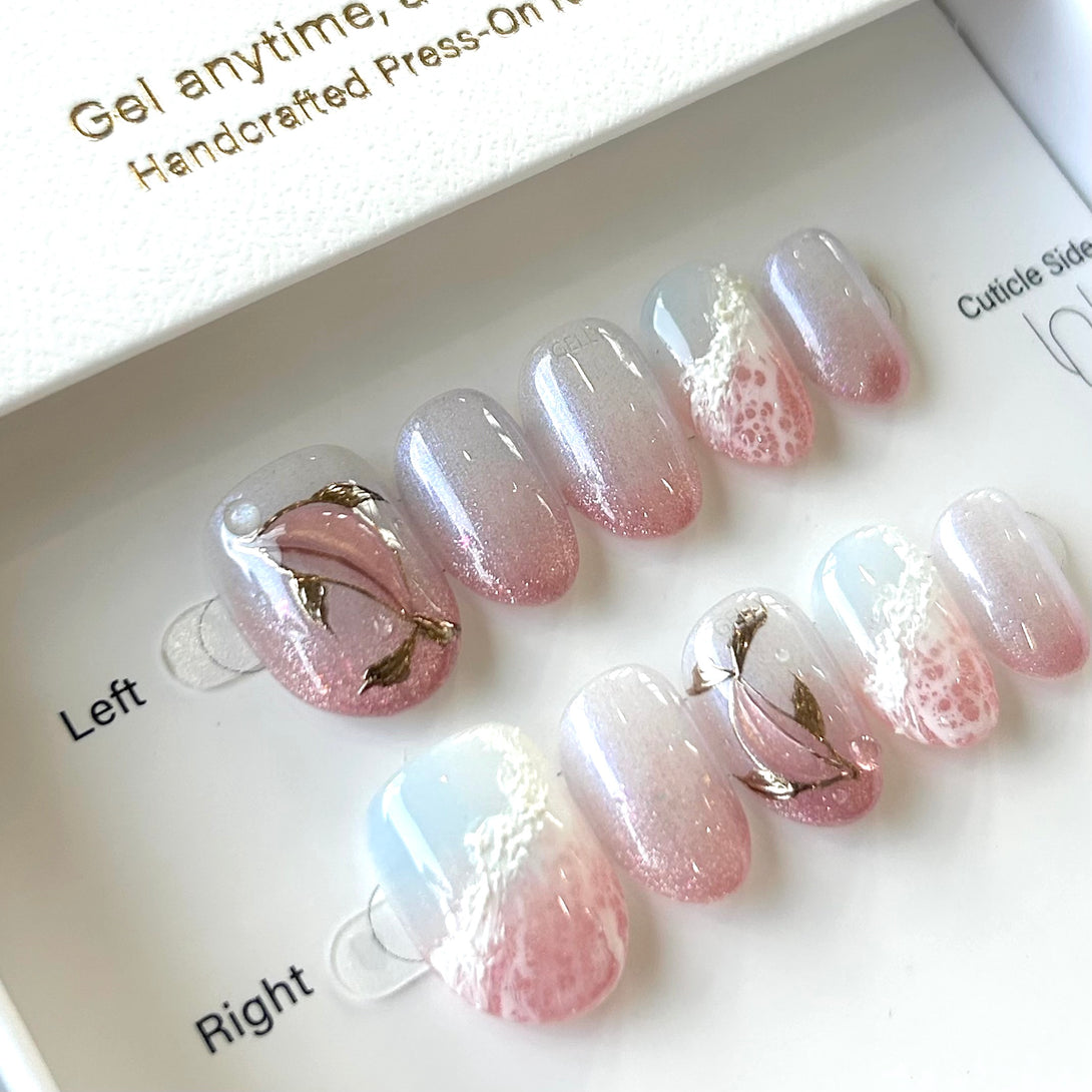 Set of press-on nails with gradient design on a branded box