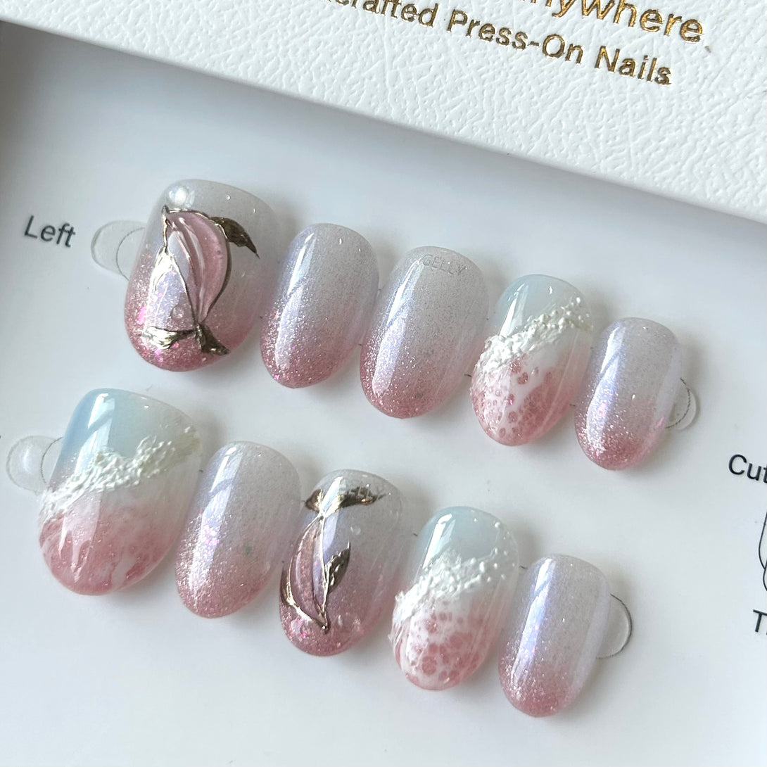 Set of pink and white press-on nails on a display card.