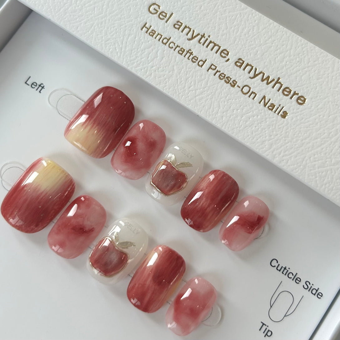 Set of press-on nails with gradient design in a box labeled 'Gel anytime, anywhere'.